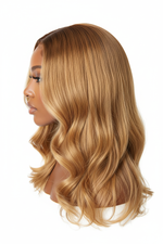 Side view of Honey Blonde 27 body wave wig showing warm golden tones